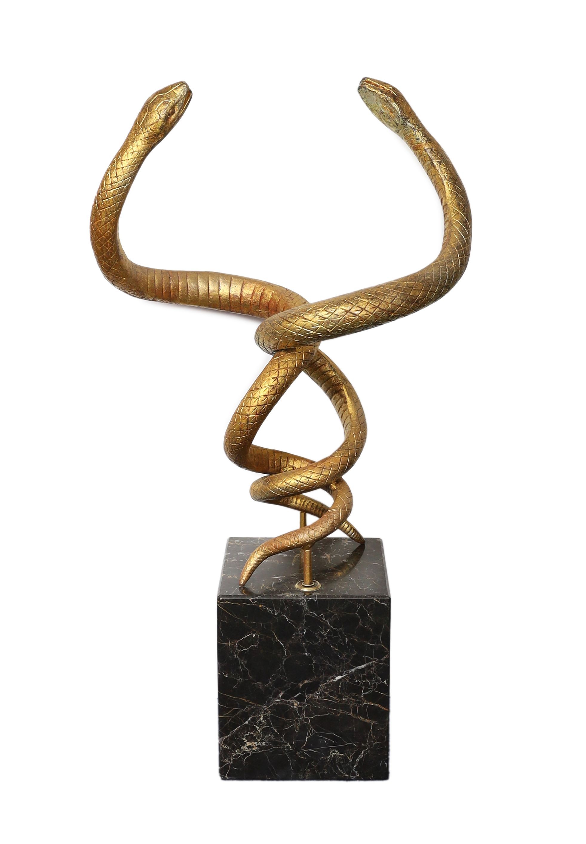 After Edgar Brandt. A gilt cast iron group of two entwined snakes, width 66cm height 121cm
